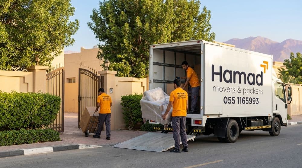 Professional movers and packers in Al Ain – Hamad Movers team loading a truck outside a modern UAE villa