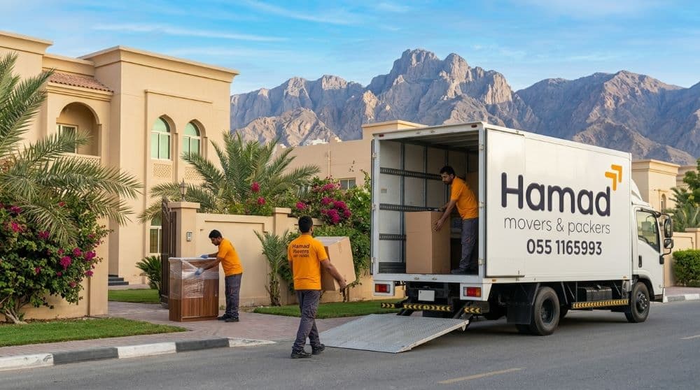 Professional movers and packers in Ras Al Khaimah – Hamad Movers team loading a truck outside a modern UAE villa