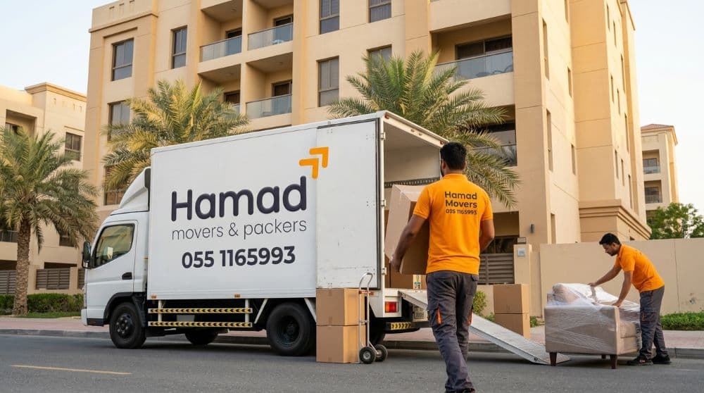 Professional movers and packers in Sharjah – Hamad Movers team loading a white branded truck